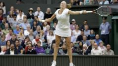 Petra Kvitová of the Czech Republic plays a return to Serena Williams of the United States during a quarterfinals match at the All England Lawn Tennis Championships at Wimbledon, England, Tuesday, July 3, 2012. (AP Photo/Anja Niedringhaus)