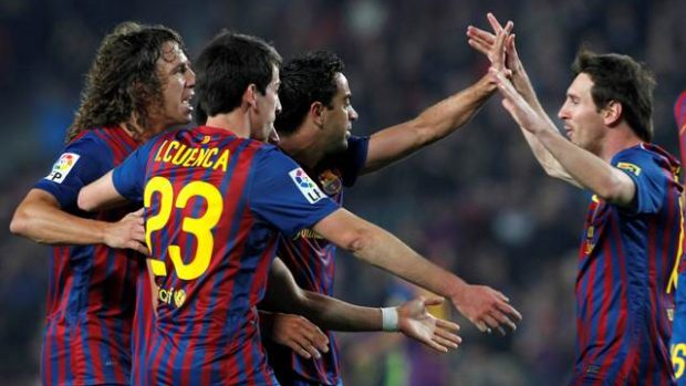 Barcelona&#039;s Carles Puyol, Isaac Cuenca, Xavi Hernandez and Lionel Messi celebrate a goal against Getafe during their Spanish First division soccer match