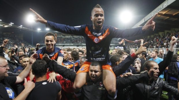Montpellier&#039;s John Chukwudi Utaka reacts after becoming champions of the French Ligue 1 after defeating Auxerre at the Abbe Deschamps stadium in Auxerre, May 20, 2012