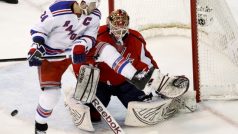 New York Rangers&#039; Ryan Callahan leaps in the air in front of Washington Capitals goaltender Braden Holtby during first period of game six of their NHL Easter Conference hockey semi-final game in Washington May 9, 2012