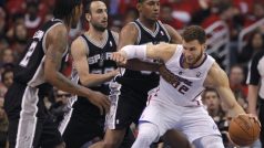 Los Angeles Clippers  power forward Blake Griffin (32) is guarded by San Antonio Spurs small forward Kawhi Leonard (2), Manu Ginobili (20) and Boris Diaw (33) during Game 4 of their NBA Western Conference semi-final playoff basketball game in Los Angeles