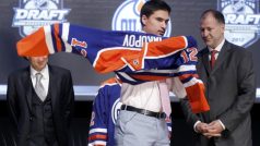 Nail Yakupov puts on his new jersey after being picked by the Edmonton Oilers in the first round of the NHL draft in Pittsburgh, Pennsylvania, June 22, 2012