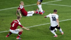 Germany&#039;s Lukas Podolski scores the opening goal during the Euro 2012 soccer championship Group B match between Denmark and Germany in Lviv, Ukraine, Sunday, June 17, 2012. (AP Photo/Michael Probst)