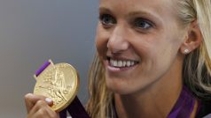 Dana Vollmer of the U.S. poses with her gold medal after setting a world record to win the women&#039;s 100m butterfly final at the London 2012 Olympic Games at the Aquatics Centre July 29, 2012