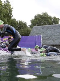 Lisa Norden (L) of Sweden  and Radka Vodičková of Czech Republic leave the water at the women&#039;s triathlon final during the London  2012 Olympic Games